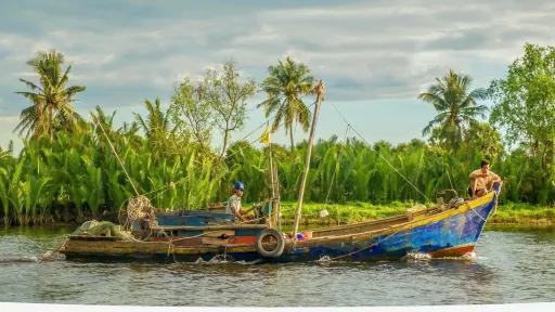 long boat on a rural river
