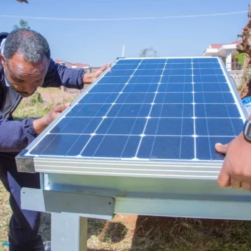 Man installing solar panel