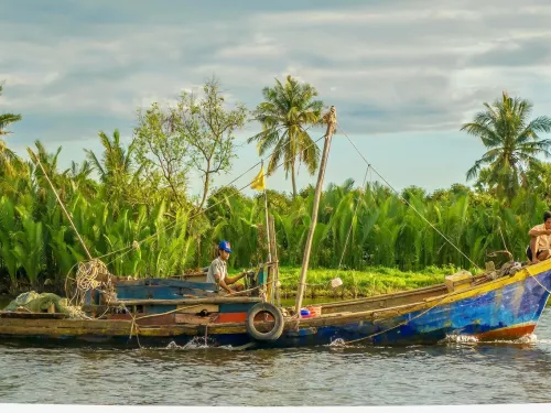 long boat on a rural river